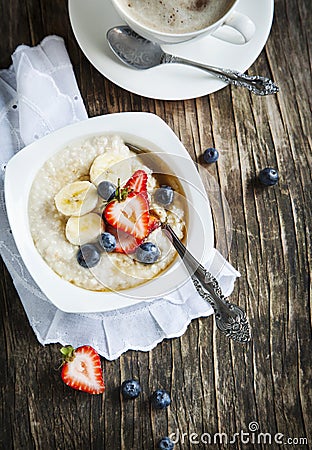 Healthy breakfast with Oatmeal, maple syrup and Berries Stock Photo