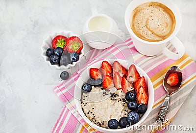 Healthy breakfast with oatmeal porridge, fresh berries and coffee Stock Photo