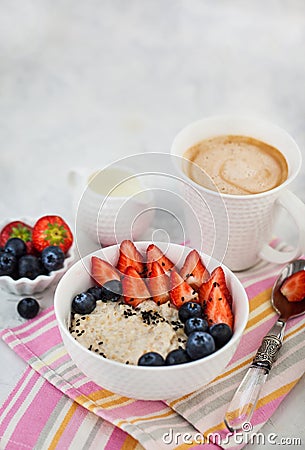 Healthy breakfast with oatmeal porridge, fresh berries and coffee Stock Photo