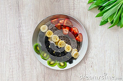 Healthy Breakfast - Plant-based Diet - Fruit Bowl On White Wooden Background Stock Photo