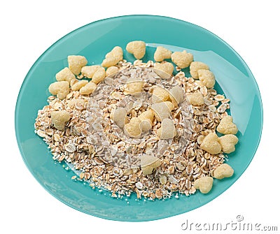 Healthy breakfast on a plate isolated on white background.muesli with cornflakes, raisins, dates, pears and pineapple dried cashew Stock Photo