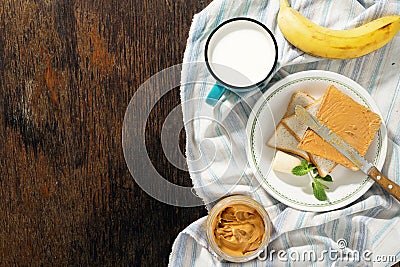 Healthy breakfast. Sandwiches peanut butter, banana, milk top vi Stock Photo