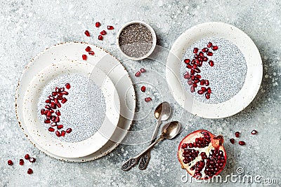 Healthy breakfast set. Chia seed pudding bowls with pomegranate Stock Photo