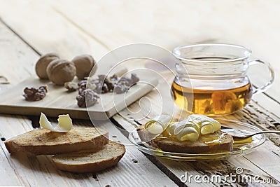 Healthy breakfast with slices of toast bread with butter curl and honey Stock Photo