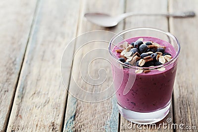 Healthy breakfast of smoothie, dessert, yogurt or milkshake with frozen berry and oats decorated grated chocolate Stock Photo