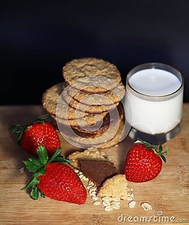 Healthy breakfast with strawberry, cereals, milk and oat chocolate cookies Stock Photo