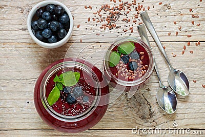 Healthy Breakfast. Summer dessert. Smoothies of blueberries with Chia seeds and flax seed and fresh juicy berries Stock Photo