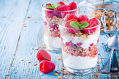 Healthy breakfast: yogurt parfait with granola and fresh raspberries Stock Photo