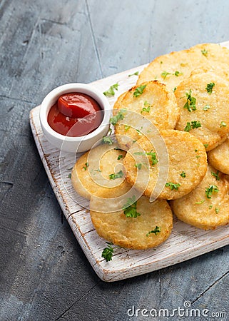 Healthy Cauliflower hash browns on white wooden board Stock Photo