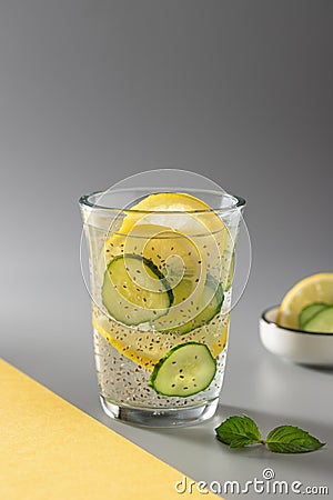 Healthy chia water with cucumber and lemon in a glass. Stock Photo