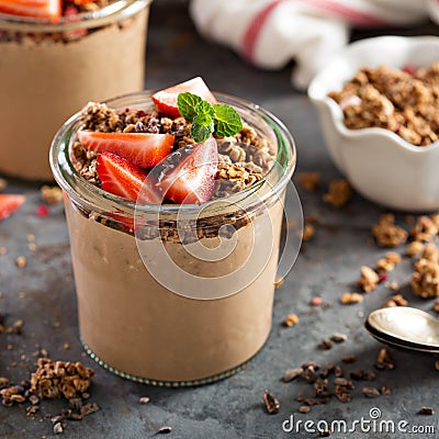 Healthy chocolate banana smoothie with granola Stock Photo