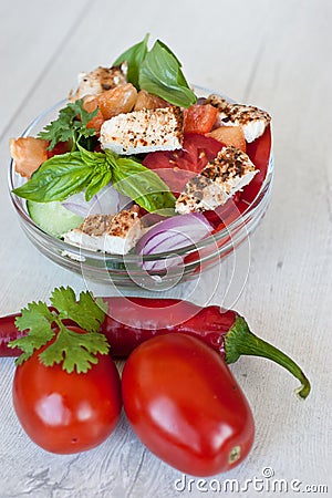 Healthy cooking of salad with fresh delicious ingredients making on cutting board. Stock Photo