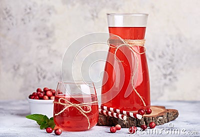 Healthy cranberry juice drink and fresh cranberries. Traditional Russian beverage mors Stock Photo