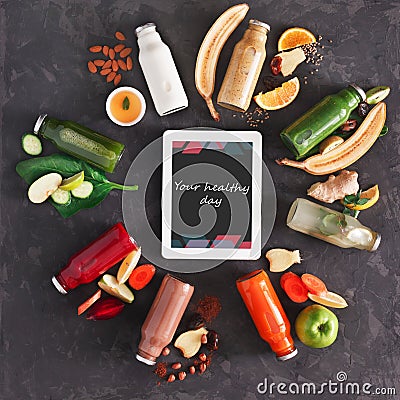 Healthy detox drinks with ingredients and tablet on black background Stock Photo