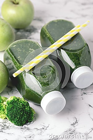 Healthy Detox Green Smoothie with Green Apples and Ripe Broccoli in Bottles Healthy Diet Food Drink Vertical Above White Stock Photo