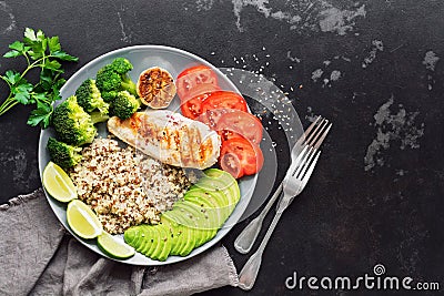 Healthy diet food quinoa, grilled chicken, avocado, broccoli, tomato. The concept of beneficial nutrition. Overhead,copy space Stock Photo