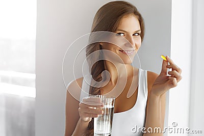 Healthy Diet. Nutrition. Vitamins. Healthy Eating, Lifestyle. Woman With Fish Oil Capsules. Stock Photo