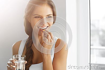 Healthy Diet. Nutrition. Vitamins. Healthy Eating, Lifestyle. Woman With Fish Oil Capsules. Stock Photo