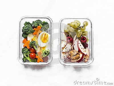 Healthy diet snack, breakfast lunch box on light background, top view. Boiled egg, fresh vegetables and fruits - tasty healthy Stock Photo