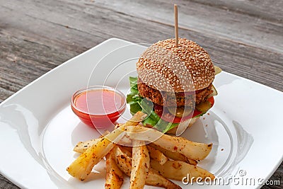 Vegan Burger, ingredients: sesame bun, Patty of chickpeas, chili Stock Photo