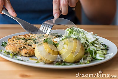 A healthy dinner made at home - Chicken meatballs with fresh potatoes Stock Photo