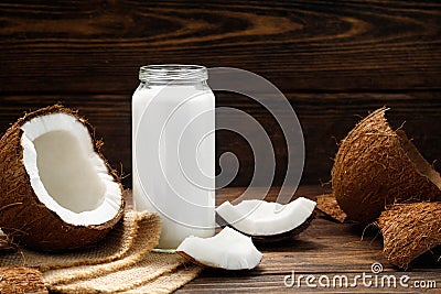 Healthy drink - vegan non dairy fresh coconut milk in glass bottle Stock Photo