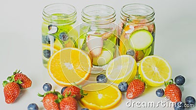 Healthy drinks made organic fruit from farm,detox fruit mixed with clear water,cool beverage summer refreshing, on white Stock Photo