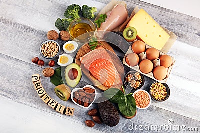 Healthy eating and diet concept, natural rich in protein food on rustic table with wooden letter protein Stock Photo