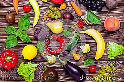 Healthy eating, diet, detox background. Assortment of bright organic fresh fruits and vegetables on the dark wooden table. Vegan, Stock Photo
