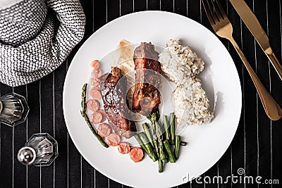 Healthy eating . diet food dinner dish. pork ribs and green bean, carrot , quinoa Stock Photo