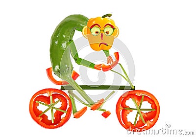 Healthy eating. Funny little pepper on a bicycle Stock Photo