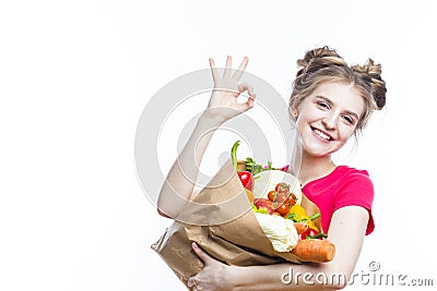 Healthy Eating and Lifestyle. Positive Caucasian Girl Posing With Eco Shopping Bag Filled With Vegetables Showing OK Sign Stock Photo