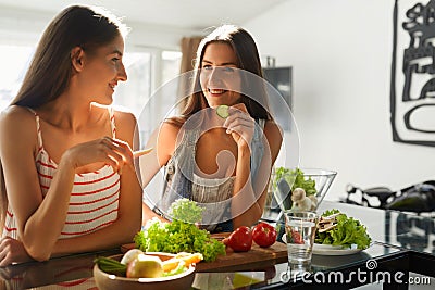 Healthy Eating Women Cooking Salad In Kitchen. Fitness Diet Food Stock Photo