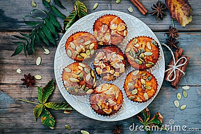 Healthy fall vegetarian dessert. Apple cupcake with pumpkin, almond seeds Stock Photo