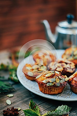 Healthy fall vegetarian dessert. Apple cupcake with pumpkin, almond seeds Stock Photo