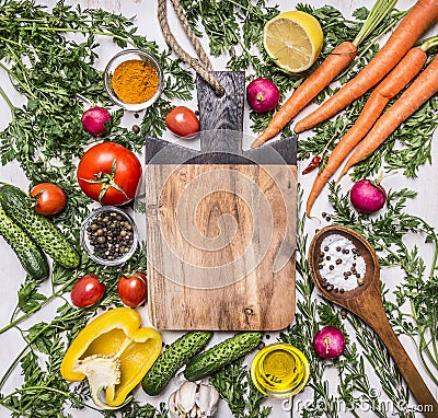 Healthy food background with colorful various vegetables for tasty cooking around the cutting board place for text, frame on woode Stock Photo