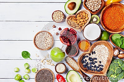 Healthy food background from fruits, vegetables, cereal, nuts and superfood. Dietary and balanced vegetarian eating products Stock Photo