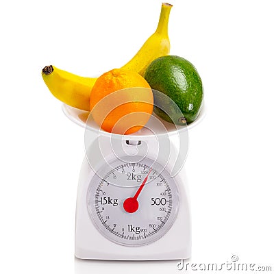 Healthy food on balance scale Stock Photo