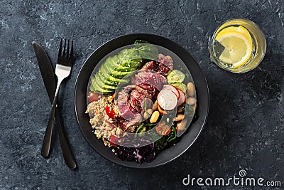 Healthy food buddha bowl with beef steak, beans, couscous, avocado vegetables Stock Photo