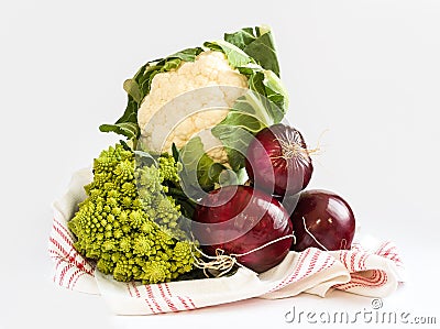Healthy food Cauliflower Romanesco and red onions on a kitchen towel Stock Photo