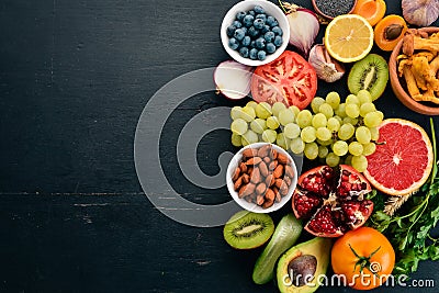 Healthy food clean eating selection: Vegetables, fruits, nuts, berries and mushrooms, parsley, spices. Stock Photo