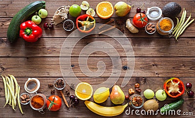 Healthy food, clean food selection: fruits, vegetables, seeds, spices on brown boards with place for text Stock Photo