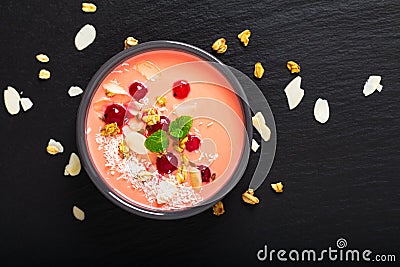 Healthy food by color of 2019 living coral Yogurt Breakfast Bowl with coconut, almond, flax seeds, Granola, and red currants in Stock Photo
