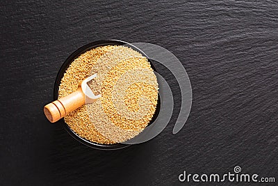 Healthy food concept organic Amaranth grains in black ceramic bowl with copy space Stock Photo