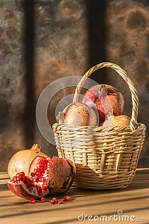 Basket with pomegranates Stock Photo