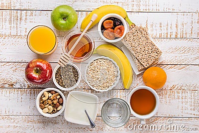 Healthy Food Fiber Source Breakfast Oatmeal Honey Fruits Apples Banana Orange Juice Water Green Tea Nuts. White Plank Wood Table Stock Photo