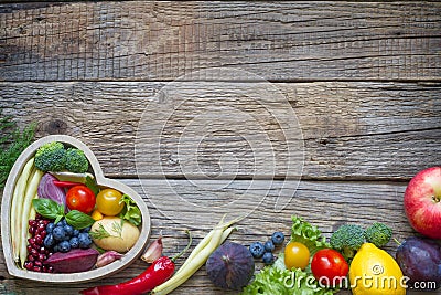 Healthy food in heart diet cooking concept with fresh fruits and vegetables Stock Photo