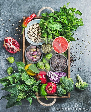 Healthy food ingredients in wooden box over grey background Stock Photo