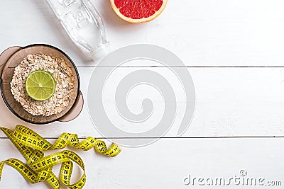 Healthy food with muesli, water and grapefruit. Top view. Stock Photo