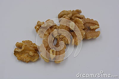 Healthy food, natural nuts, walnuts arranged on a white background. Stock Photo